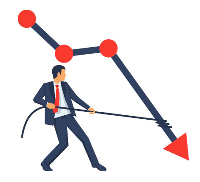 Businessman struggling against downward trend