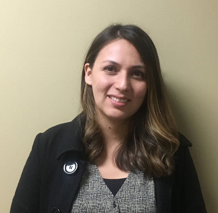 Person with long hair wearing coat