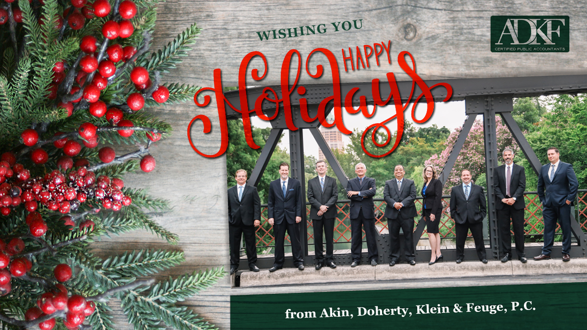 Group holiday greeting with festive decorations.