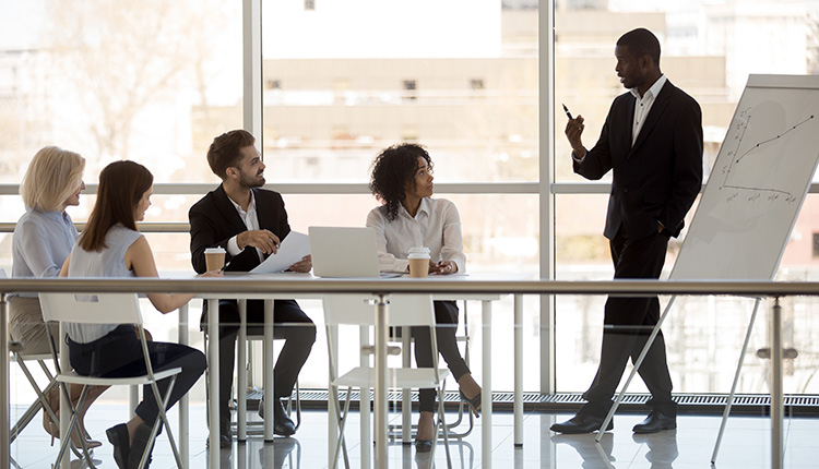 Business meeting with presentation in progress.