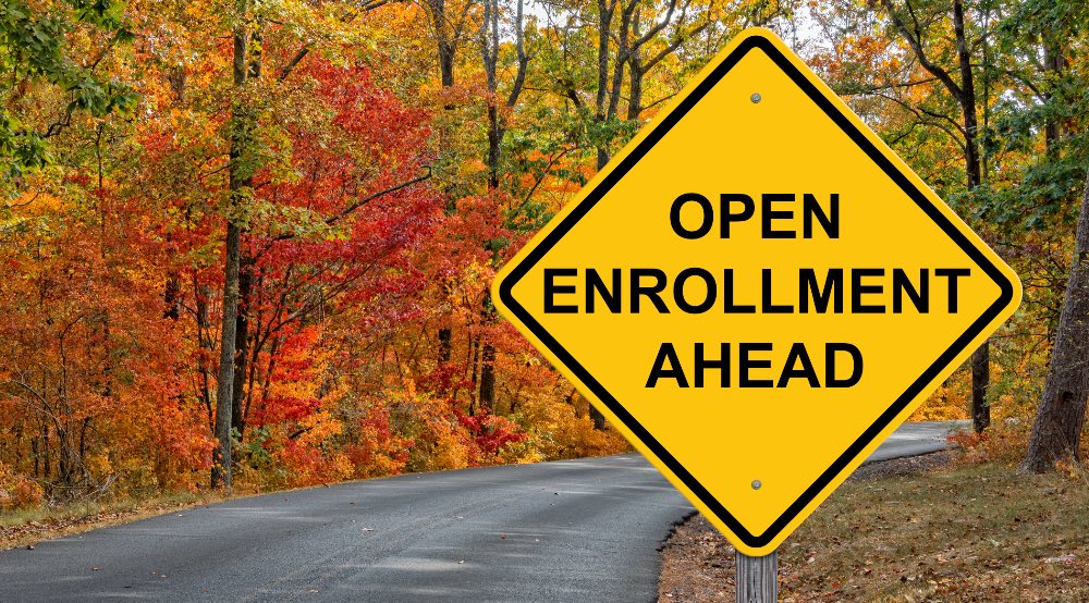 Yellow sign indicating open enrollment ahead