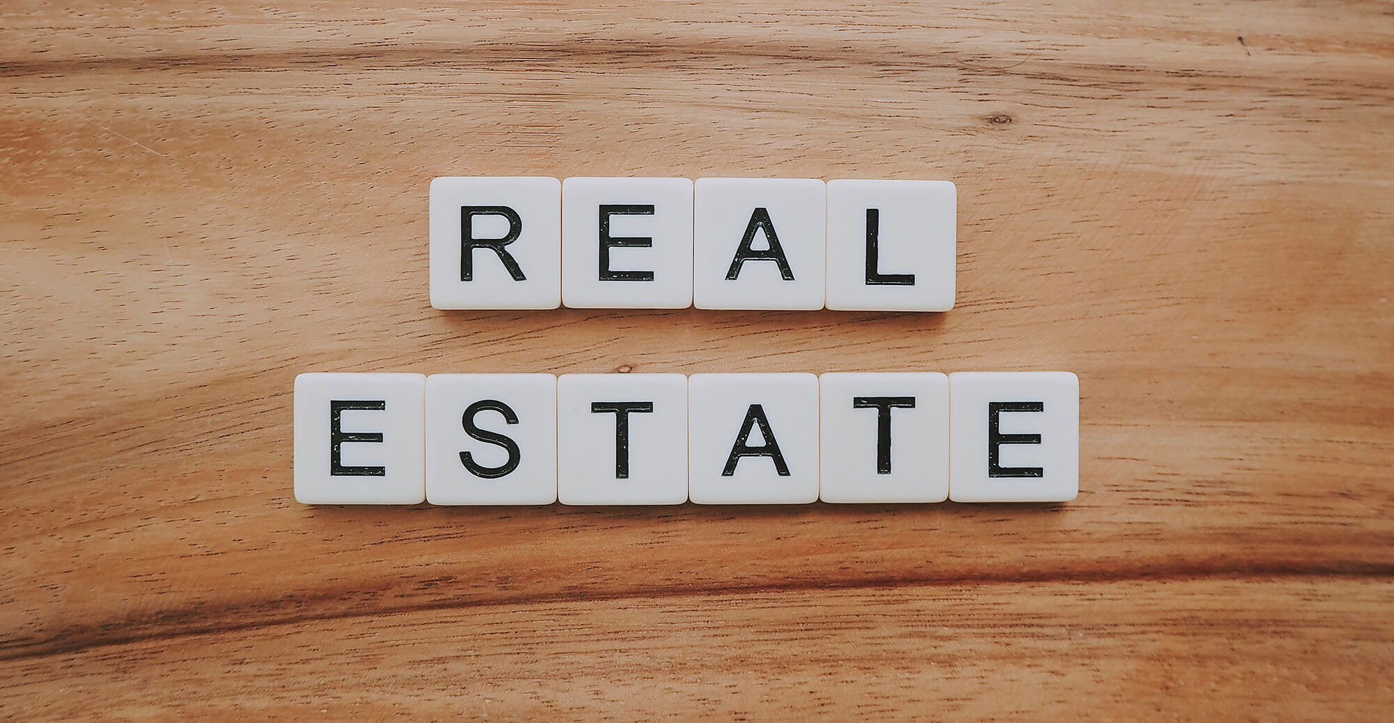 Letters spelling 'REAL ESTATE'