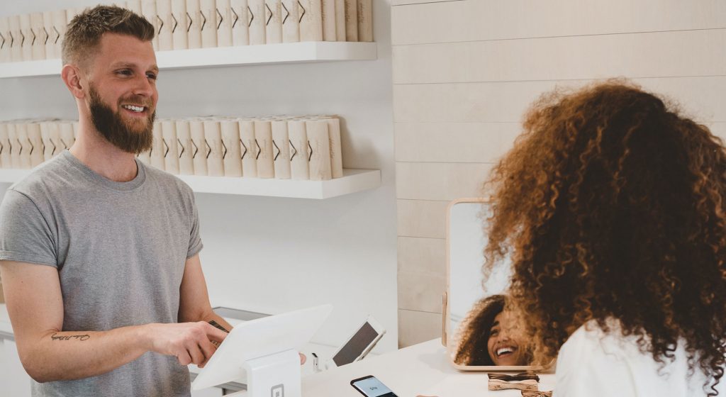Customer service interaction at a counter.