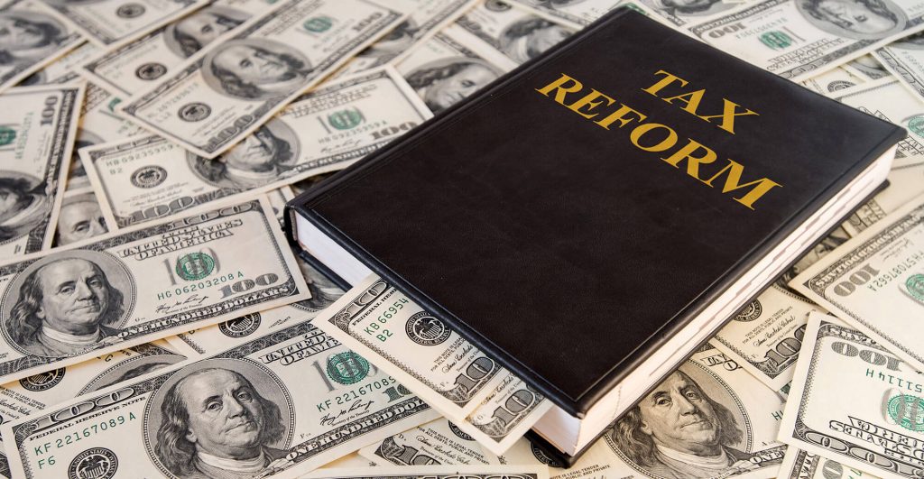 Tax reform book on money pile