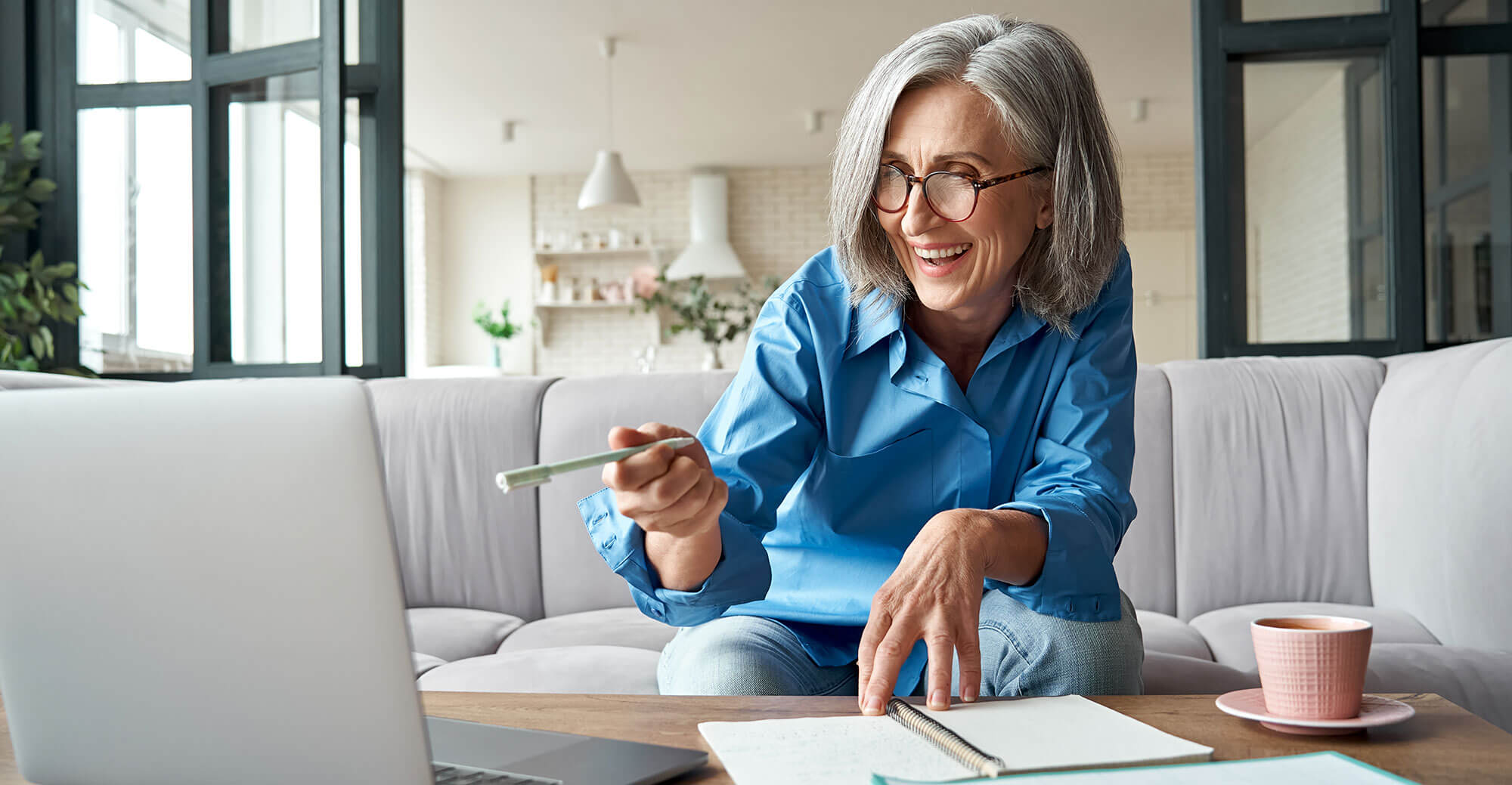 Person working on a laptop at home.