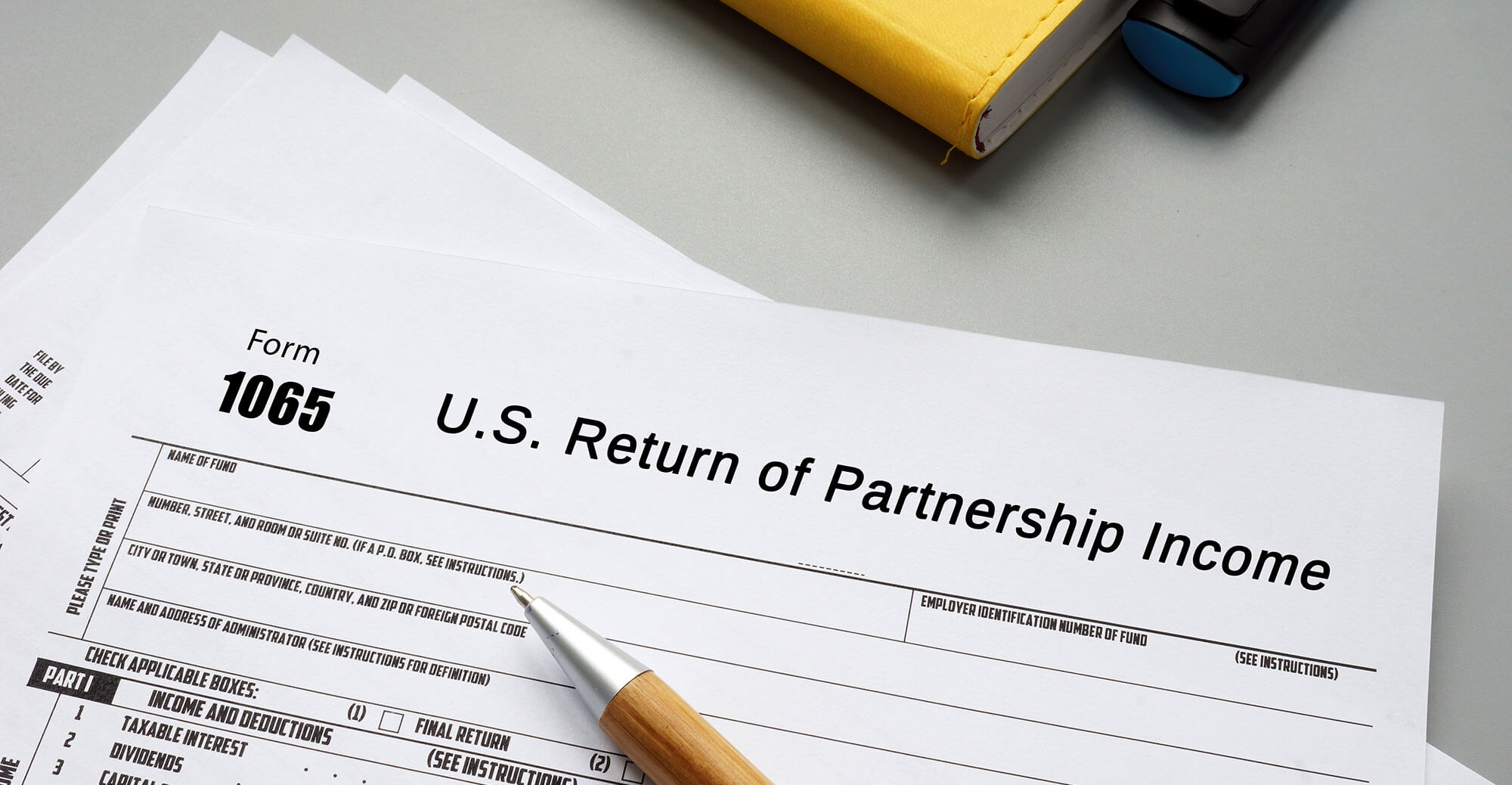 Partnership income tax form and pen