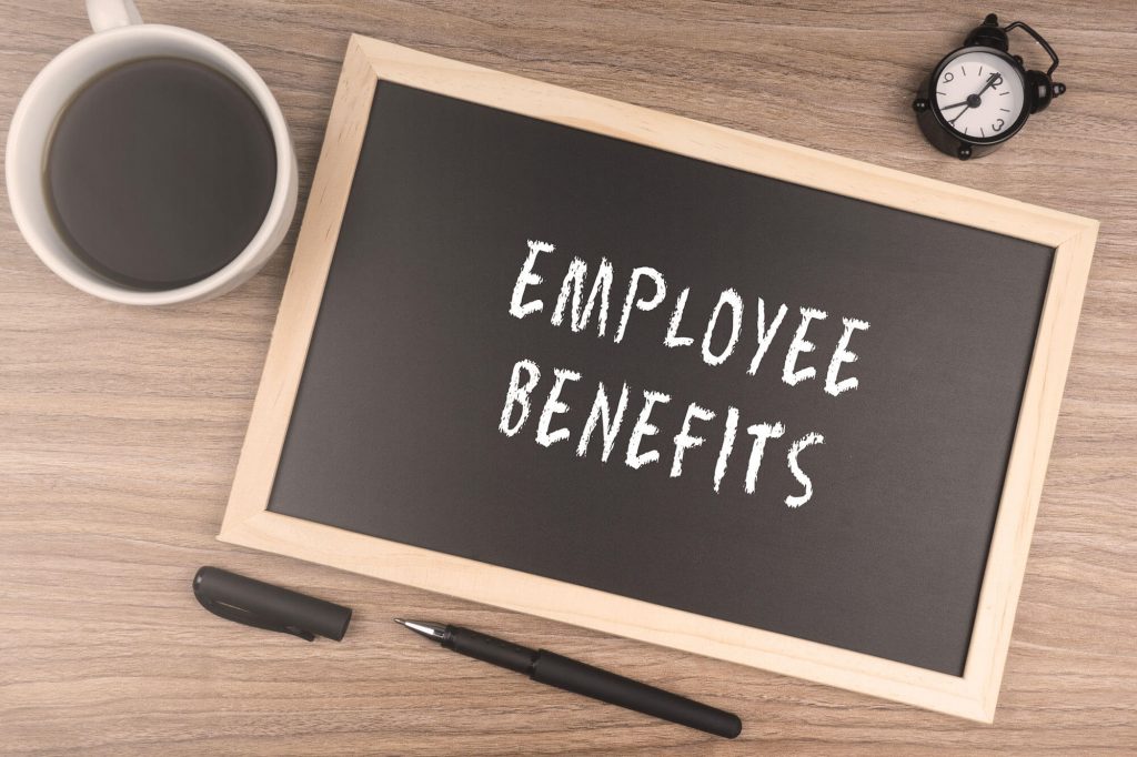 Chalkboard with employee benefits written