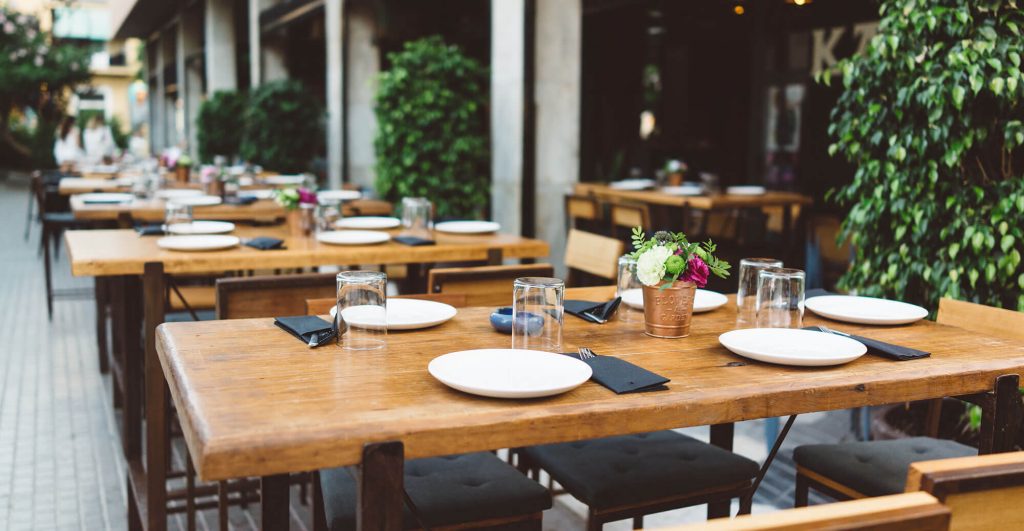 Outdoor dining setup with empty tables