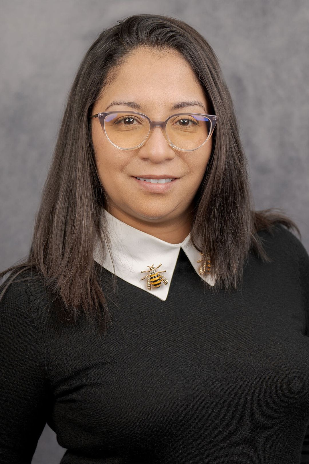 Woman in black sweater with collar