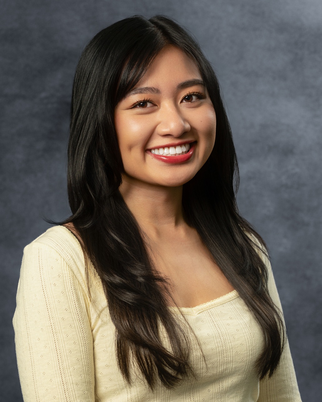 Person with long, dark hair.