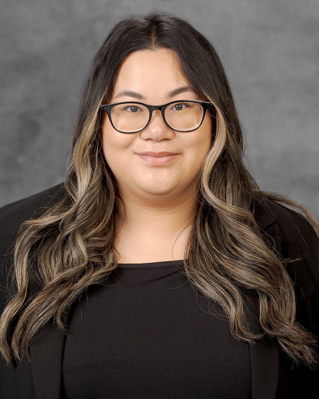 Woman with long, wavy hair.